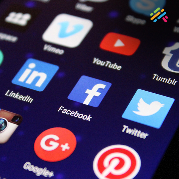A close-up of a smartphone screen showing a grid of app icons, including Facebook, YouTube, LinkedIn, Twitter, and Vimeo.